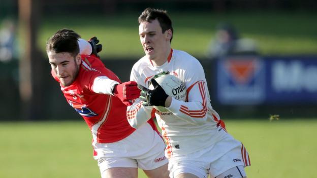 Louth's Patrick Reilly in action against Armagh's Mark Shields as Armagh mount a comeback to secure a draw at Drogheda