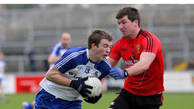 Monaghan's Jack McCarron wheels away from Down's Peter Turley as Down draw with Monaghan at Newry