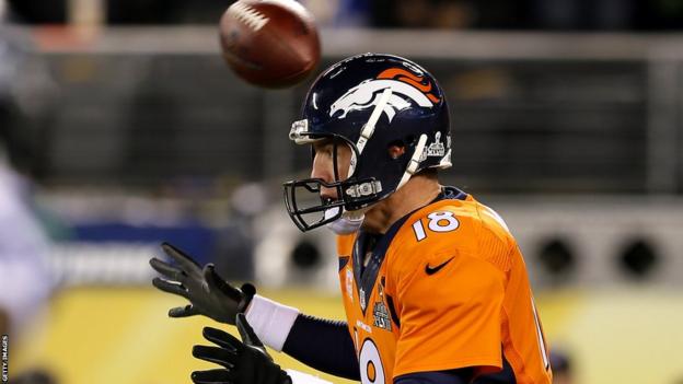 On the very first play from scrimmage, the ball is somehow snapped back over the head of non-plussed Denver quarterback Peyton Manning. The Broncos recover the ball, but in their own endzone at the cost of the two points awarded for a safety
