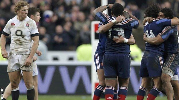 Billy Twelvetrees watches on as France celebrate