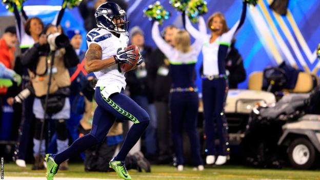 Seattle's Percy Harvin (right) returns the second-half kick-off 87 yards for a touchdown against Denver Broncos in Super Bowl XLVIII