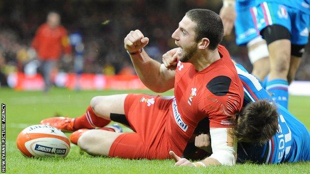 Alex Cuthbert celebrates scoring a try against Italy for Wales