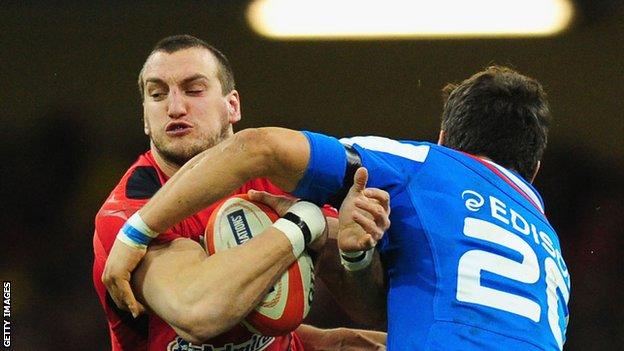 Sam Warburton is tackled while playing for Wales against Italy