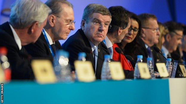 International Olympic Committee (IOC) President Thomas Bach (centre) attends the IOC meeting with former President Jacques Rogge (second left) ahead of the Sochi 2014 Winter Olympics