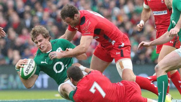 Ireland and Ulster winger Andrew Trimble in action against Welsh pair Jamie Roberts and Sam Warburton