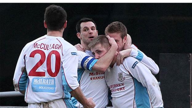 Ballymena players surround David Cushley who scored the winning goal against Linfield