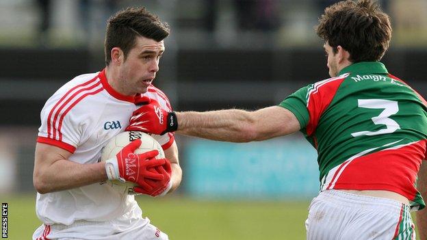 Darren McCurry of Tyrone in action against Mayo defender Ger Cafferkey