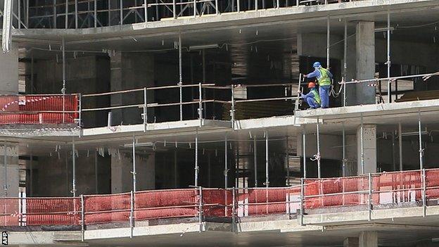 Migrant workers on a World Cup 2022 infrastructure building site in Doha