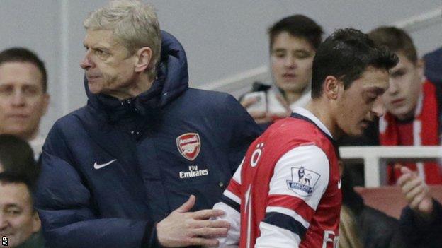 Arsenal's Arsene Wenger and Mesut Ozil