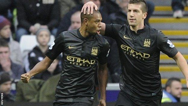 Manchester City's Fernandinho (left) celebrates scoring a goal against Swansea City