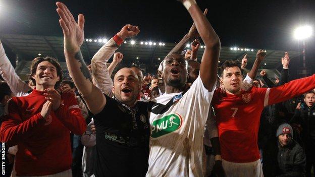 Cannes player and fans celebrate their French Cup win over Montpellier
