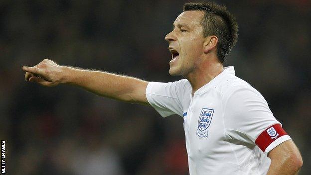 England's Captain John Terry gesturesduring the friendly football match between England and Sweden at the Wembley Stadium in London, on November 15, 2011