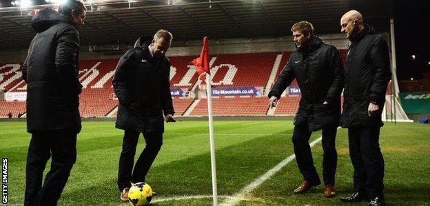 Officials test out pitch