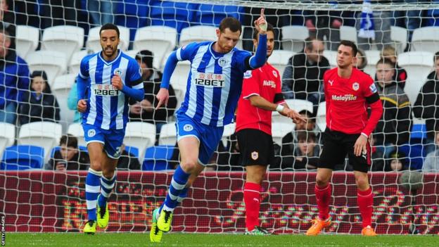 Chris McCann celebrates Wigan's opening goal in the FA Cup at Cardiff City