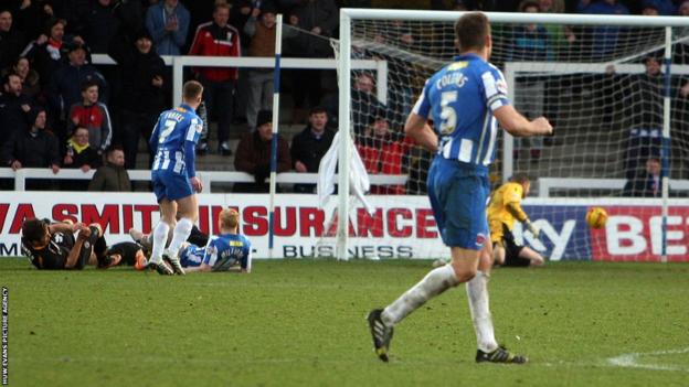 Luke Williams scores past Newport County debutant Elliot Parish in stoppage time to complete Hartlepool's 3-0 victory.