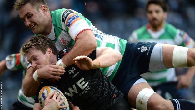 Jonathan Spratt holds on to score under intense tackle pressure in the Pro12 against Treviso in Swansea