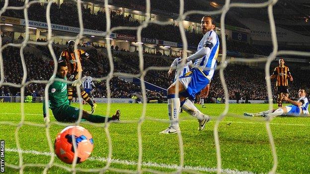 Yannick Sagbo (second left) scores a late equaliser for Hull in their 1-1 draw with Brighton in the FA Cup fifth round