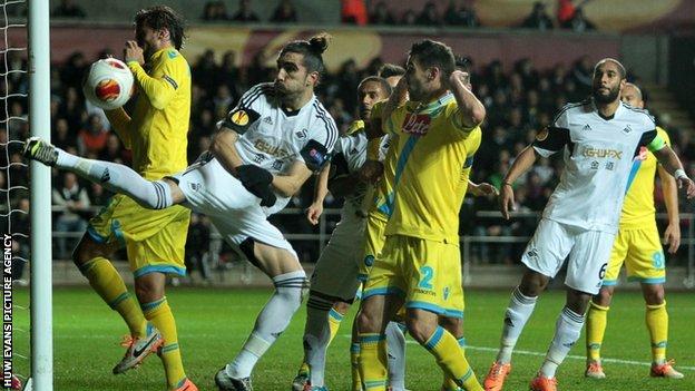 Swansea's Chico Flores in action against Napoli