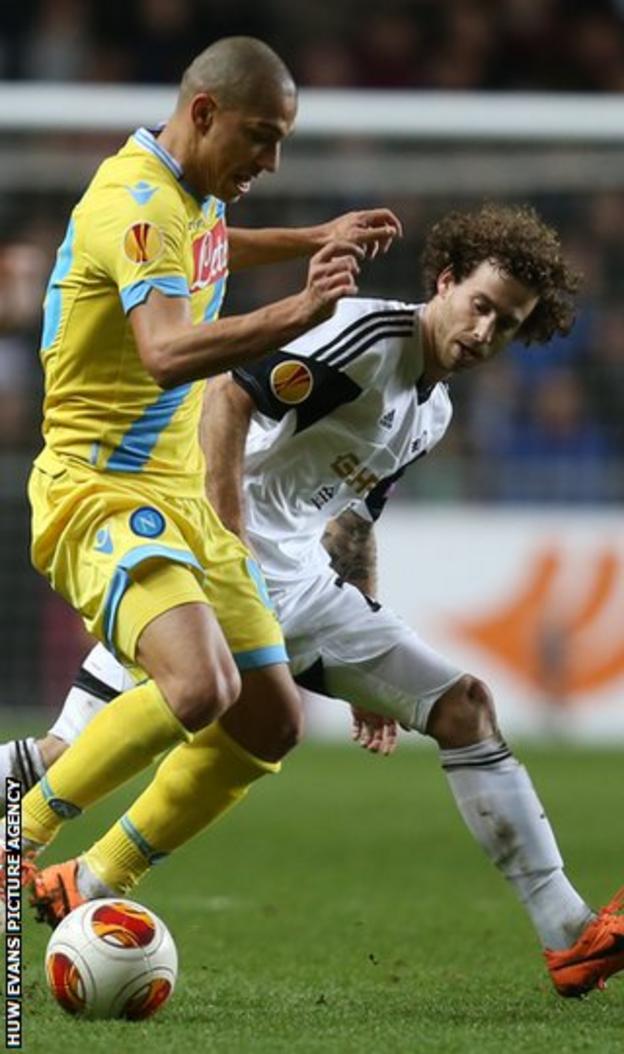 Swansea midfielder Jose Canas battles for the ball with Gokhan Inler