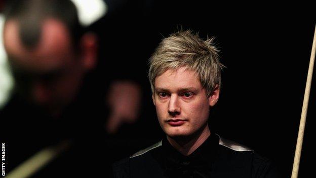 Neil Robertson watches Mark Williams at the table