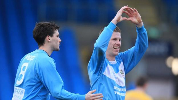 Darren Boyce celebrates the second of his two goals against Dungannon as Ballymena team-mate Gavin Taggart looks on