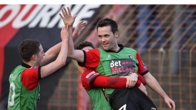 David Scullion scored a late winner for Glentoran in the sixth round replay with Armagh City at the Oval