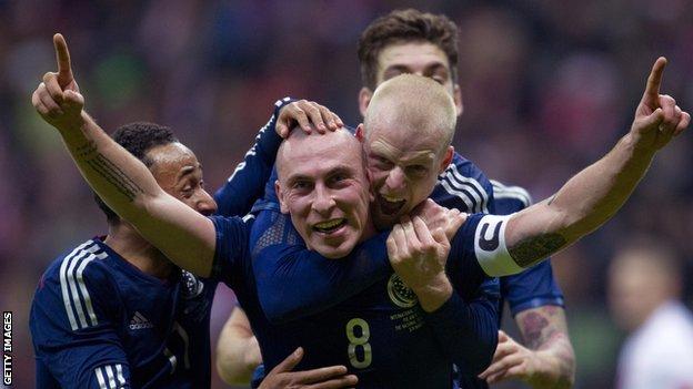 Scotland captain Scott Brown is congratulated on his winner in Warsaw