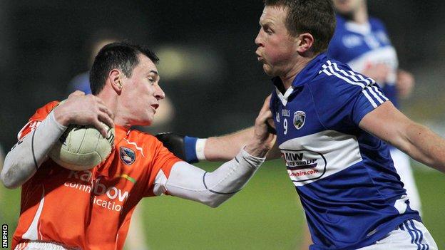 Armagh's Andy Mallon is challenged by Kevin Meaney of Laois