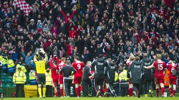 Aberdeen fans celebrate their Scottish Cup semi-final win at Celtic Park