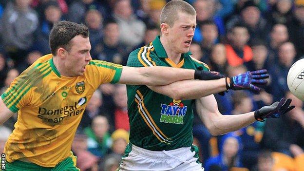 Martin McElhinney of Donegal challenges Meath opponent Kevin Reilly