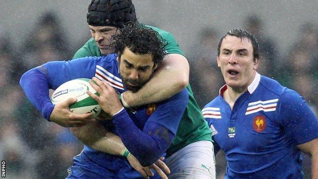 Yoann Huget is tackled by Mike Ross