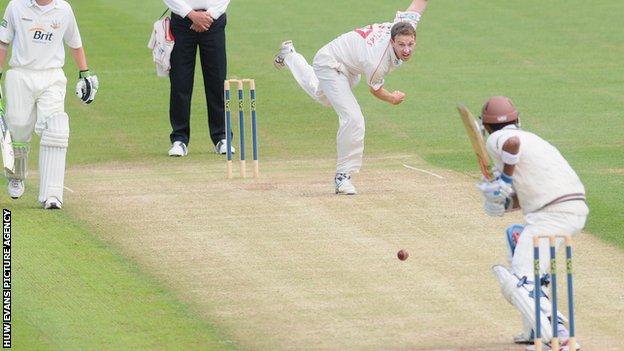 Huw Waters bowling for Glamorgan