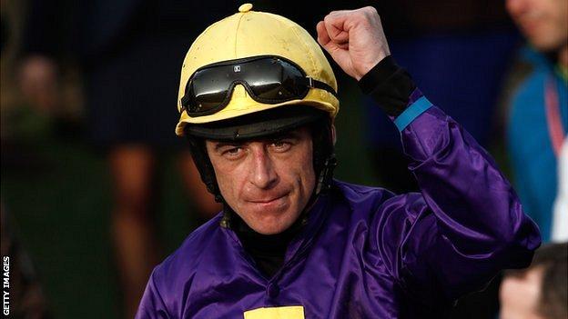Jockey Davy Russell riding Lord Windermere celebrates after winning the Cheltenham Gold Cup Steeple Chase race on the final day of the Cheltenham Festival horse racing meeting at Cheltenham Racecourse.