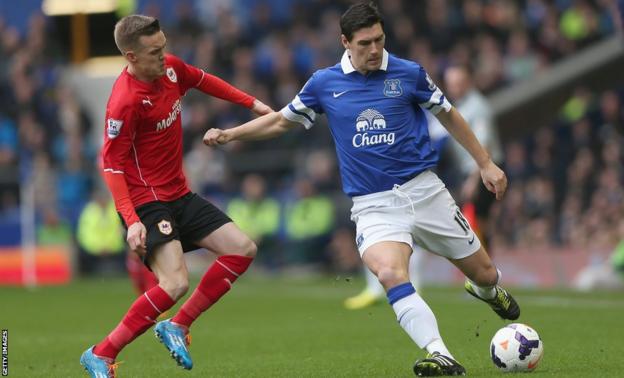 Cardiff City’s Craig Noone challenges Everton midfielder Gareth Barry during the Premier League game at Goodison Park.