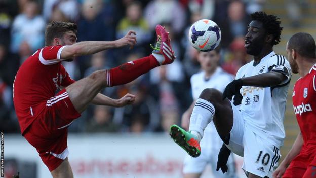 West Brom’s James Morrison challenges Swansea City striker Wilfried Bony for the ball.