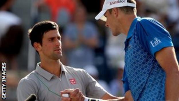 Novak Djokovic is congratulated by John Isner after beating him in their match in Indian Wells.