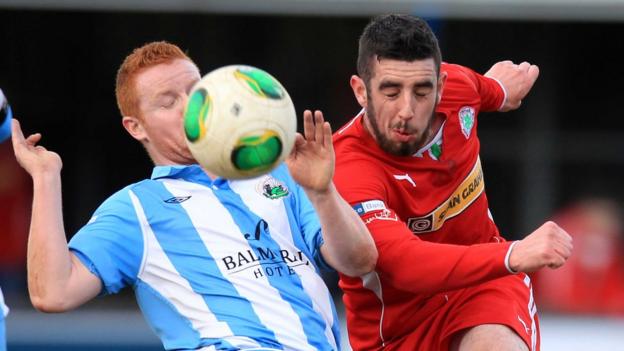 Stephen Moan and Joe Gormley in action as Cliftonville defeat Warrenpoint Town 2-0 at Stangmore Park