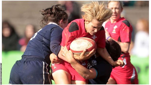 Philippa Tuttiett of Wales is tackled by Scottish defenders Tracy Balmer and Emma Wassell during the Six Nations match at the Talbot Athletic Ground on Sunday. Wales won 25-0