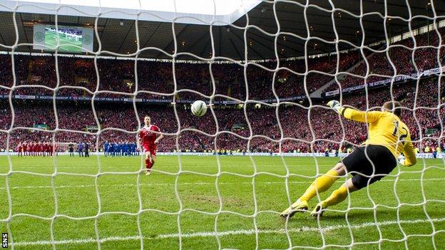 Adam Rooney scores the penalty that wins the Scottish League Cup for Aberdeen