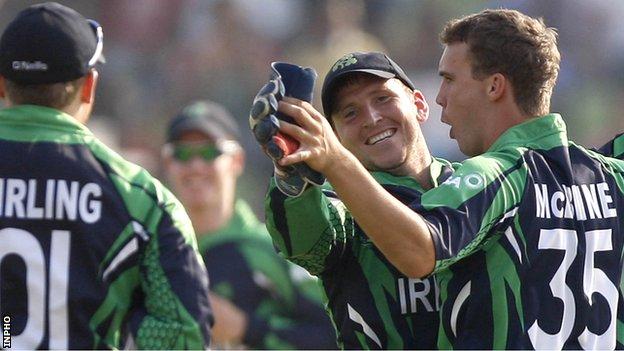 Niall O'Brien congratulates Ireland bowler Andy McBrine after he takes a wicket