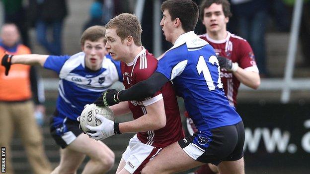 Omagh forward Conan McElduff is tackled by Meehaul McGrath of St Pat's in the final