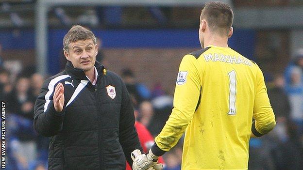 Ole Gunnar Solskjaer with Cardiff keeper David Marshall