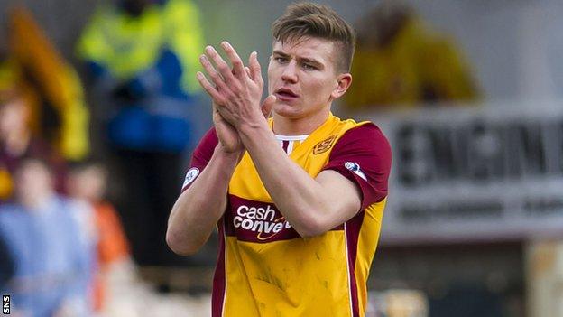 Shaun Hutchinson applauds the Motherwell support after the 2-1 win over Ross County