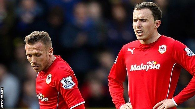 Craig Bellamy is among the dejected Cardiff players against Liverpool