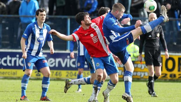 Linfield midfielder Philip Lowry competes against his brother - Coleraine's Stephen Lowry - during the 0-0 Irish Premiership draw at the Showgrounds