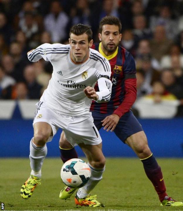 Real Madrid’s Gareth Bale battles for the ball with Barcelona defender Jordi Alba during El Clasico at the Bernabeu.