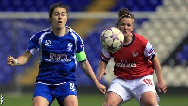 Birmingham City's Karen Carney chests the ball away from Arsenal's Emma Mitchell