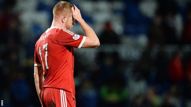 Adam Rooney rescued a point for Aberdeen against Ross County
