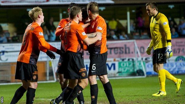 Ryan Dow's team-mates help him celebrate as Dundee United beat Inverness