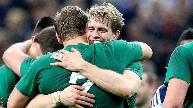 Chris Henry and Andrew Trimble embrace after Ireland clinched the Six Nations title in Paris